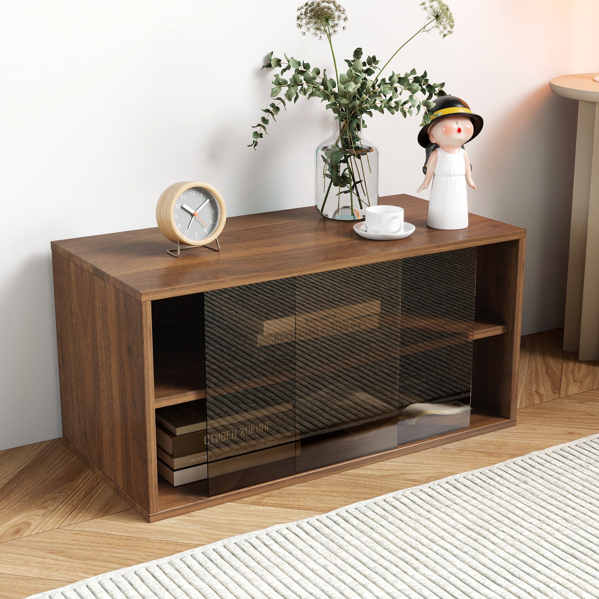 Wooden entertainment console with decorative items on a wooden floor.
