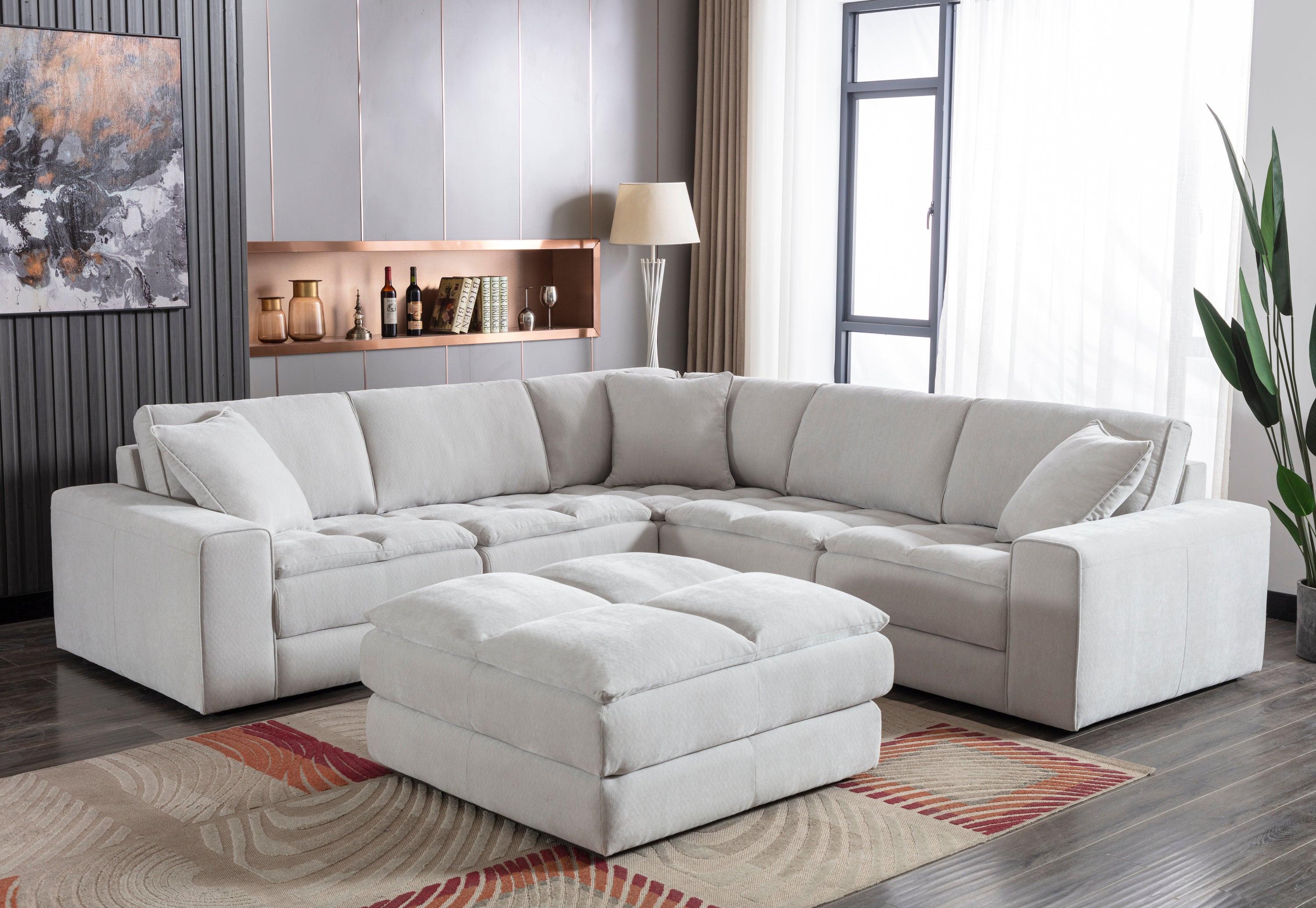 Breton Modular Sectional Sofa with Ottoman in Oyster Grey.