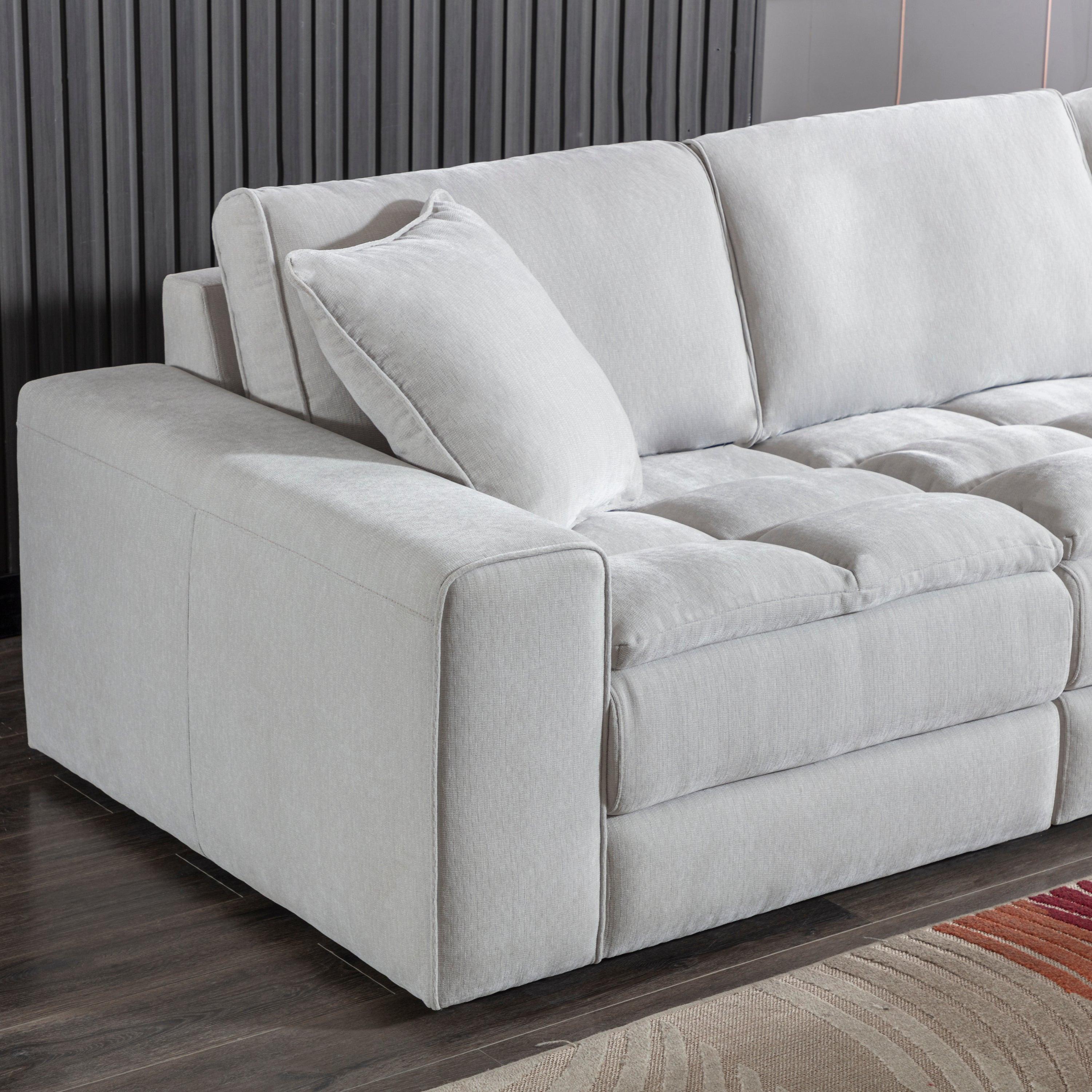 Breton Modular Sectional Sofa with Ottoman in Oyster Grey.