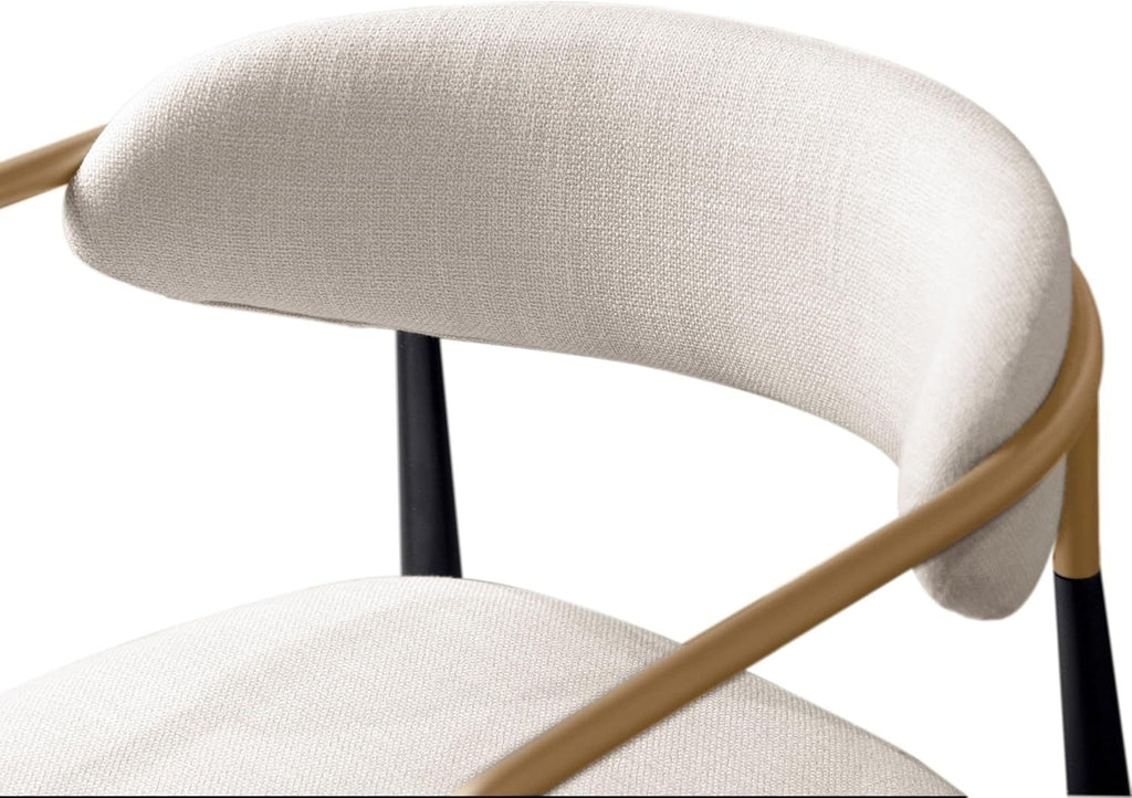 Detail view of the curved cushioned backrest and gold metal armrest of a contemporary counter height chair.