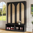 Black farmhouse hall tree with arched rattan doors, shoe storage bench, and gold hardware in a modern entryway.