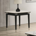 Contemporary Sintered Stone End Table with arrow legs and silver-capped feet, styled in a modern living room corner.