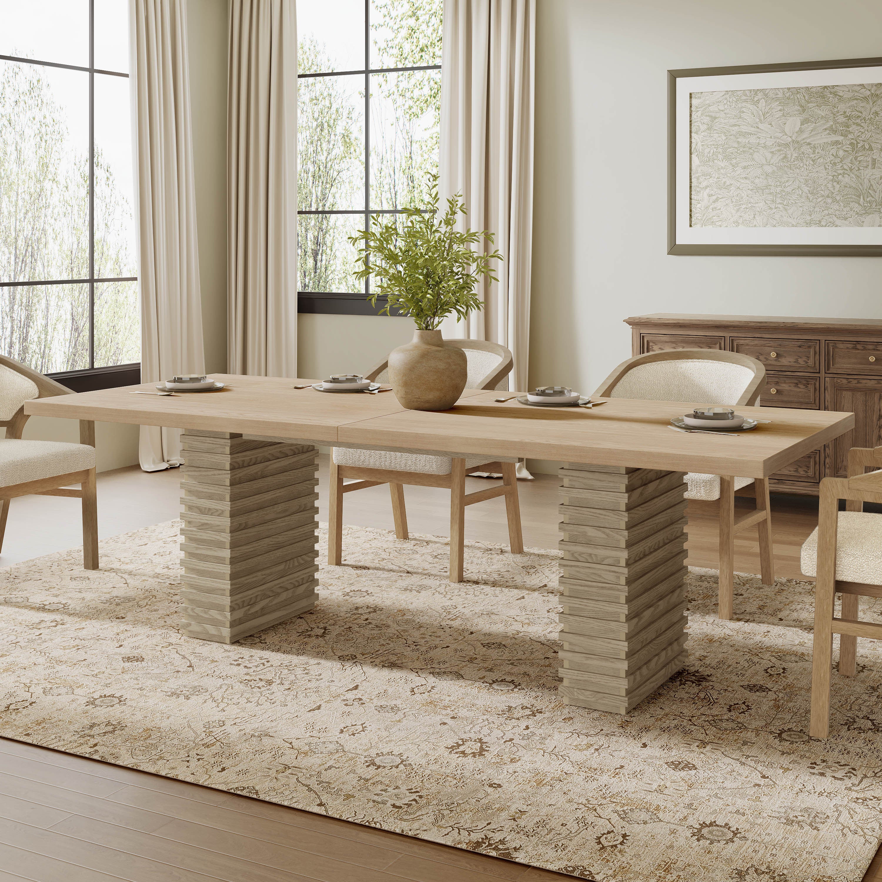 95 inch dining table in light ash finish with double pedestal base, styled in a modern dining room seating 8 people.
