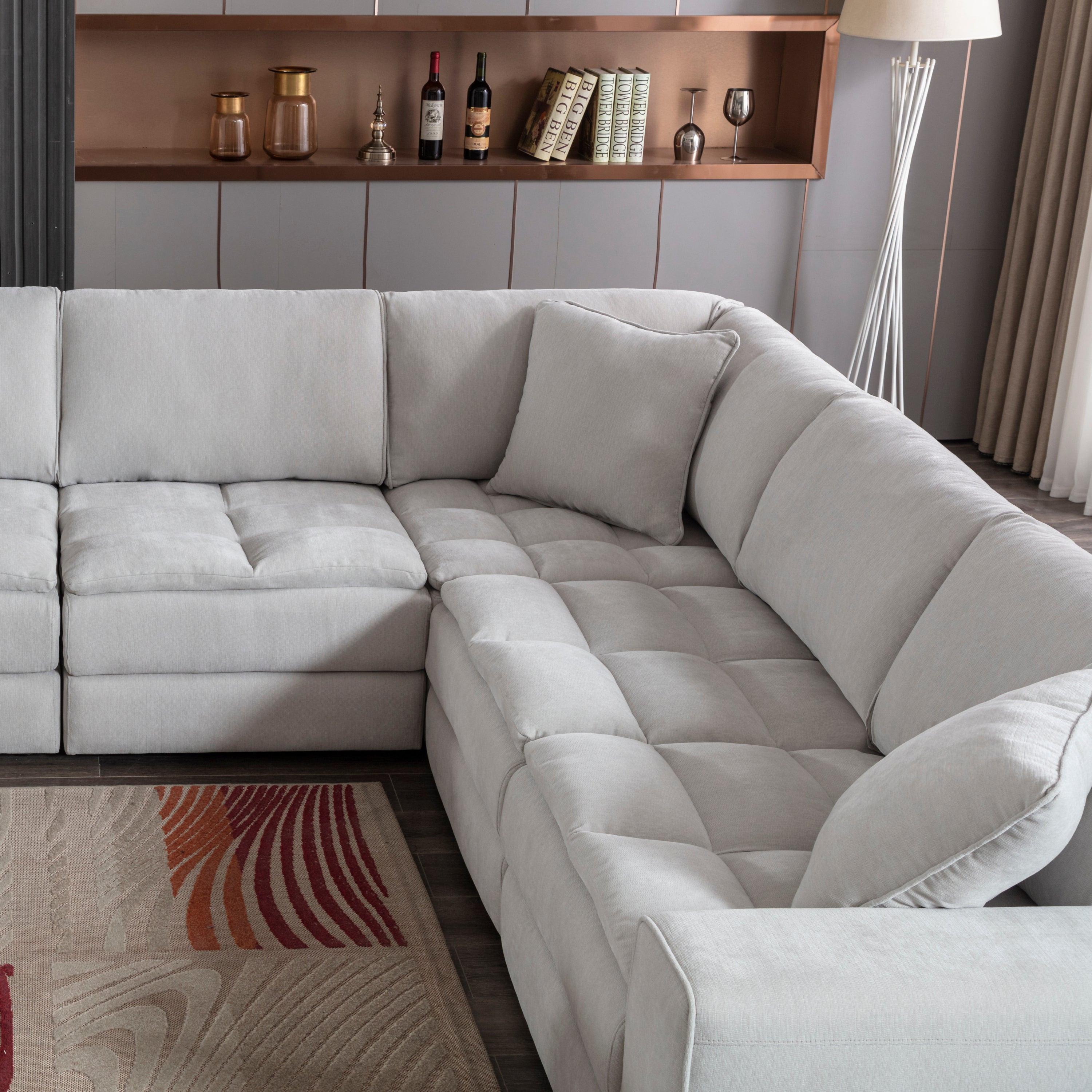 Breton Modular Sectional Sofa with Ottoman in Oyster Grey.