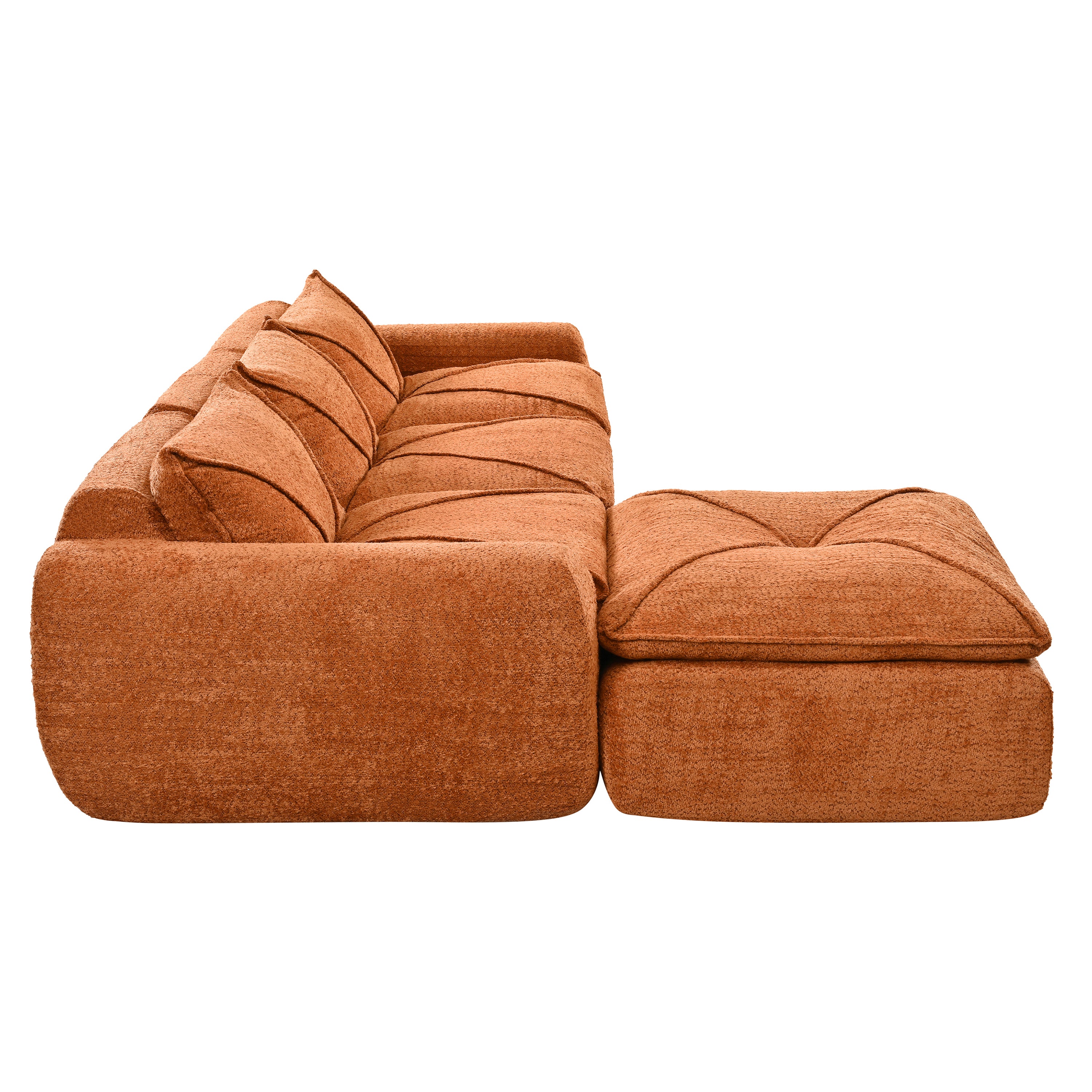Side view of 116'' compressed sofa no assembly in high density foam, showcasing deep seating and soft textured upholstery in burnt orange.