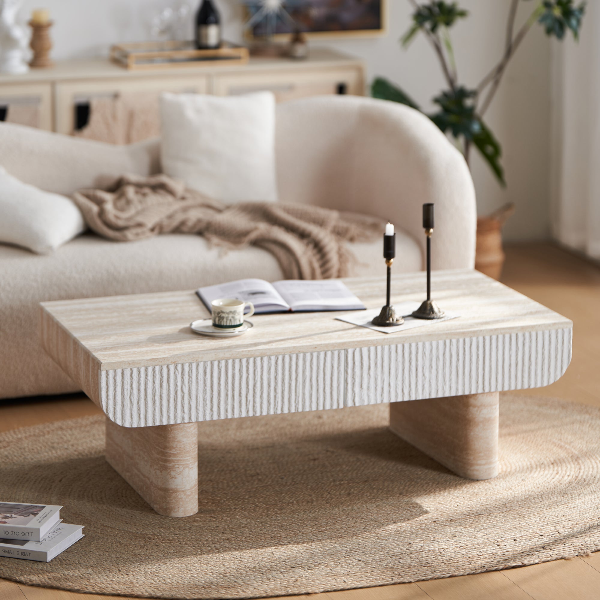 Mid-century modern coffee table with a faux marble top, white fluted drawer, and sturdy beige stone-look block legs.