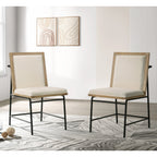 Set of 2 oak fabric dining chairs in a modern dining room setting, featuring upholstered comfort and sleek black metal frames.