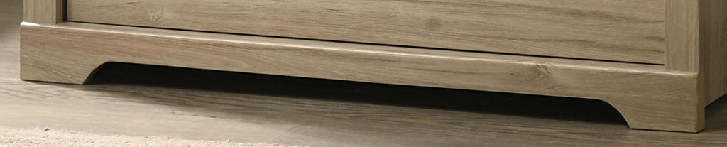 Elara 4-Drawer Light Oak Chest with Black Handles.