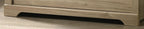 Elara 4-Drawer Light Oak Chest with Black Handles.