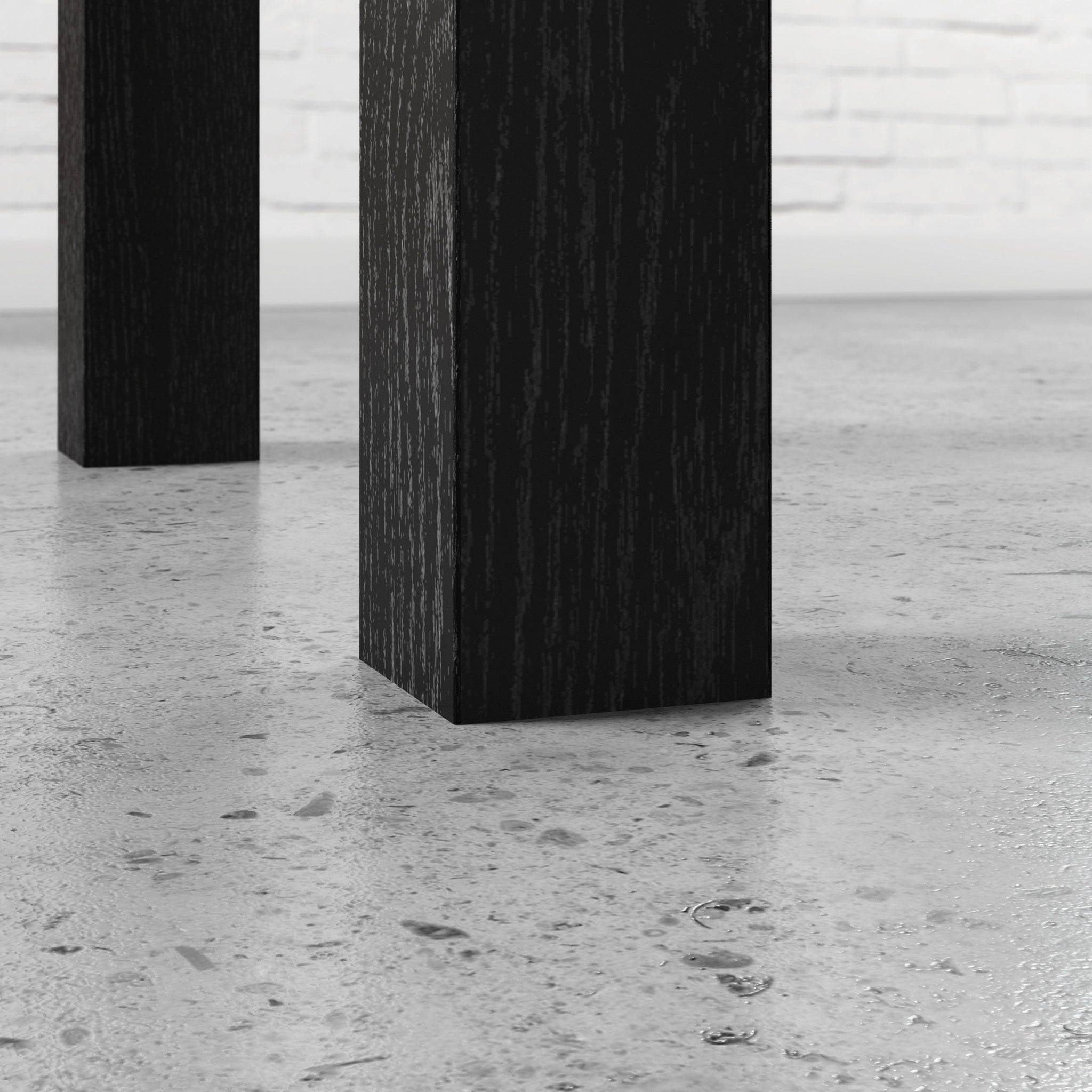 Detail of sturdy black legs on L-Shaped Desk Black Finish, emphasizing stability and modern office furniture style.