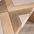 Detailed view of chevron wood inlay on modern console table, emphasizing texture and multi-tone wood finish.