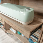 Slide-out tray in Craft Cart with Storage for Home holding a cutting machine, ideal for crafting and tool access.