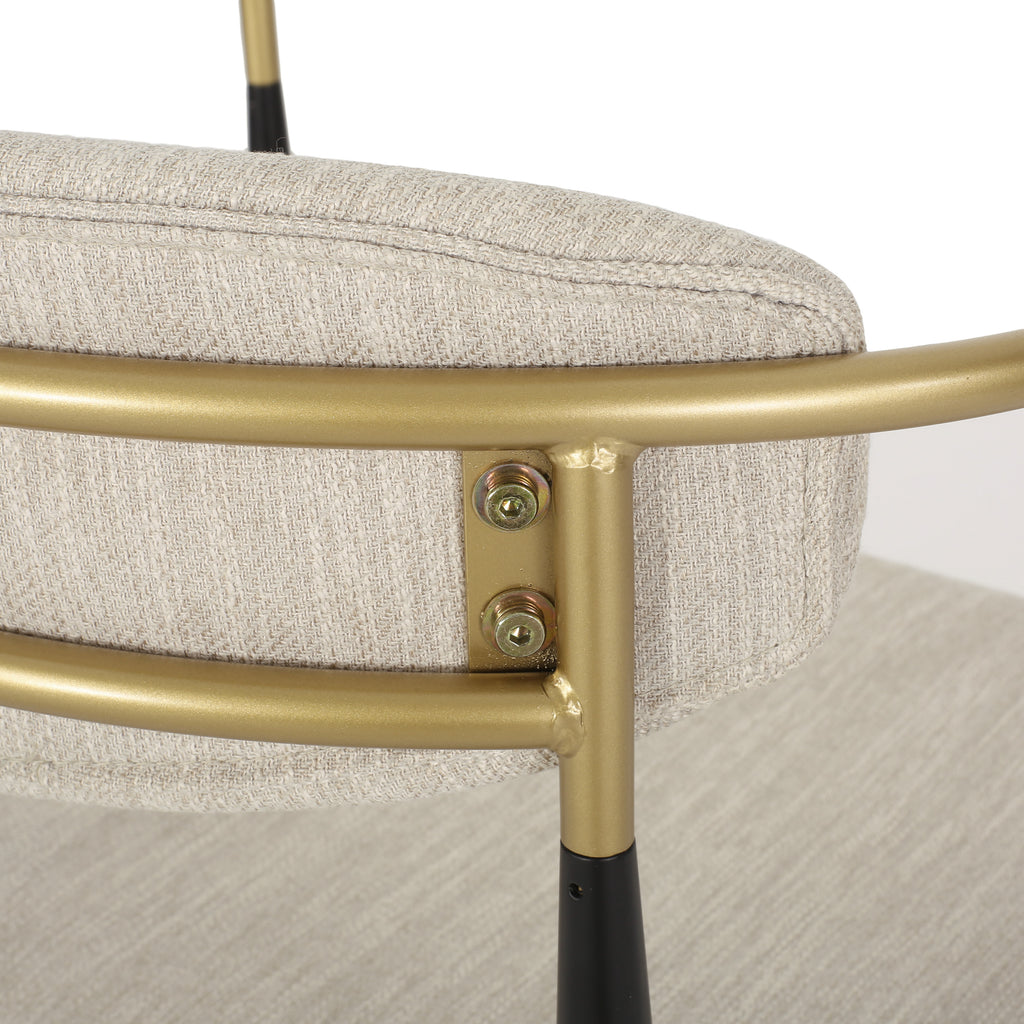Close-up of gold backrest frame and hardware on modern counter stool, showcasing durable iron construction.