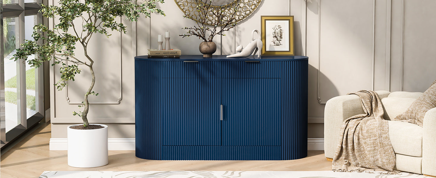 Modern navy blue MDF storage cabinet with curved doors styled in a bright living room next to a potted plant and armchair.