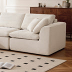 L-Shaped Sectional Sofa - Modern Corduroy Couch close-up showing plush cushions and armrest, highlighting soft chenille texture and build.