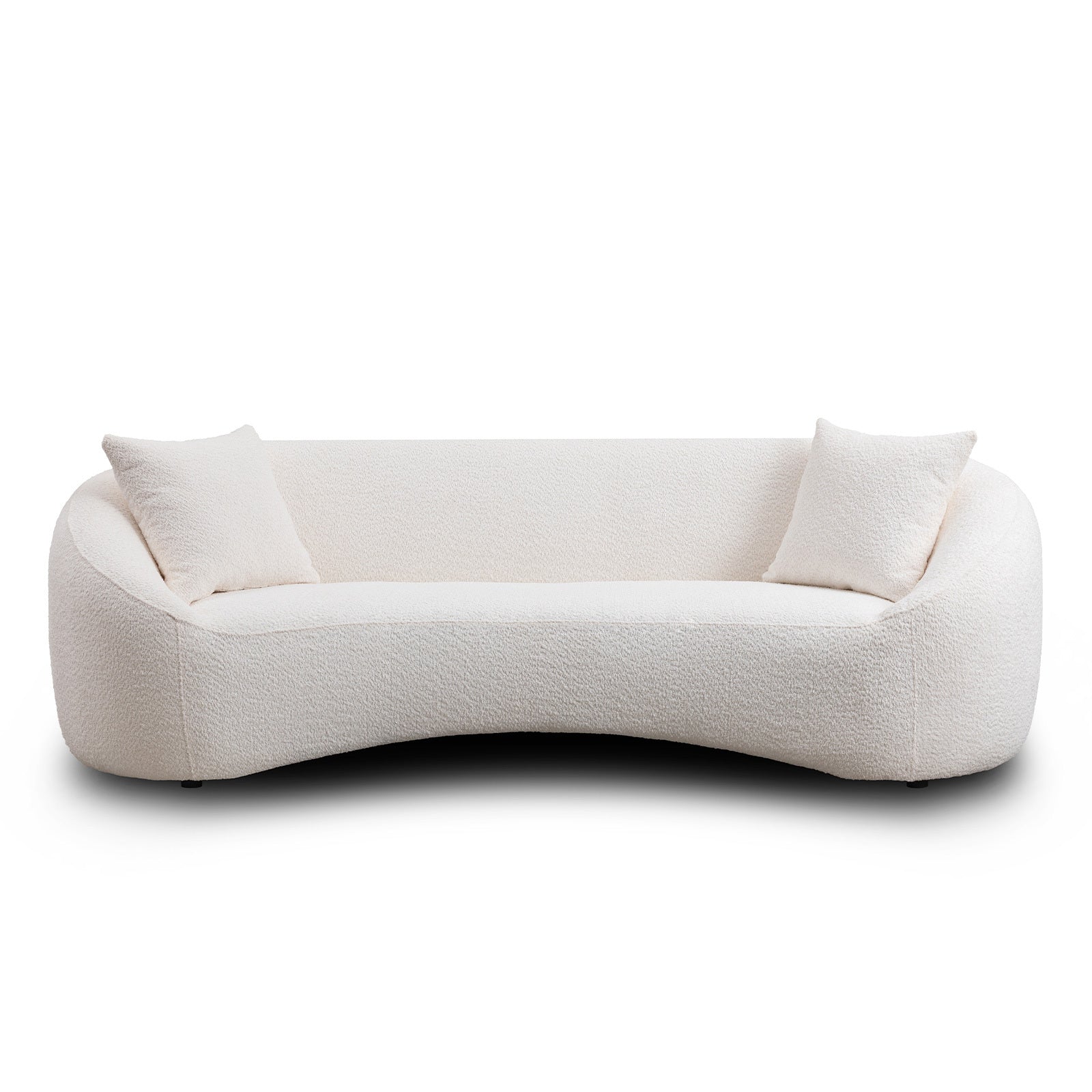 Minimalist white curved sofa with plush seating and two cushions, ideal for modern living room interiors.