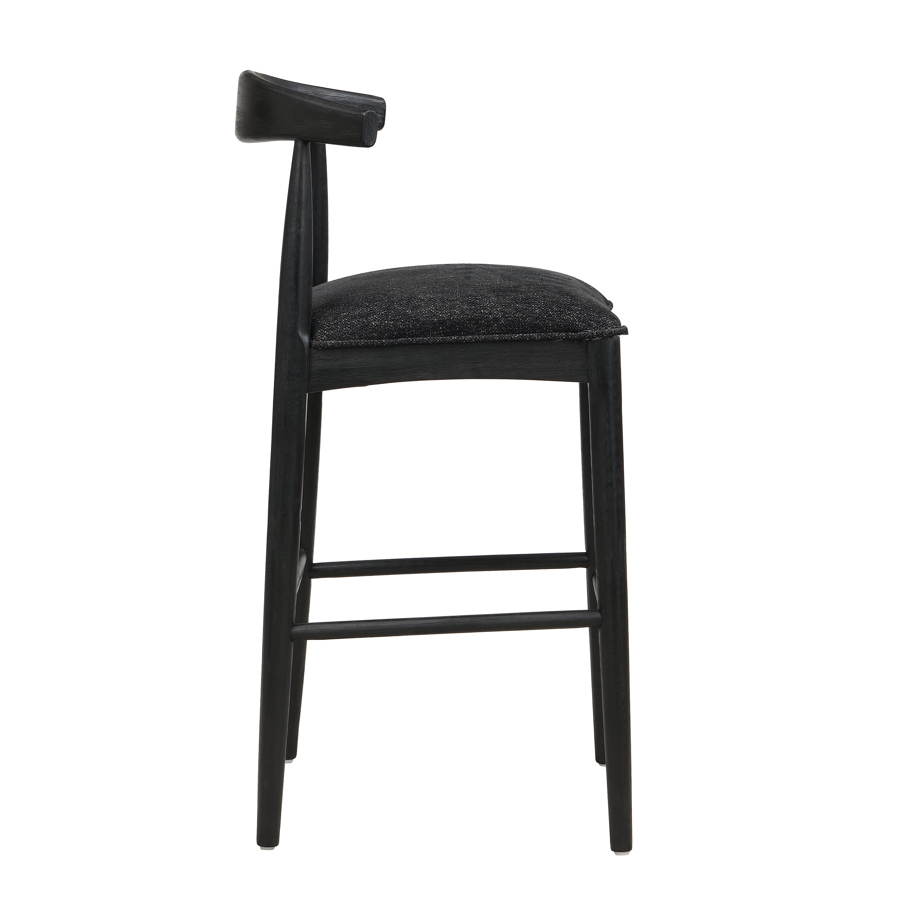 Side profile of black fabric bar stool with padded seat and angled backrest, highlighting ergonomic comfort and sleek silhouette.