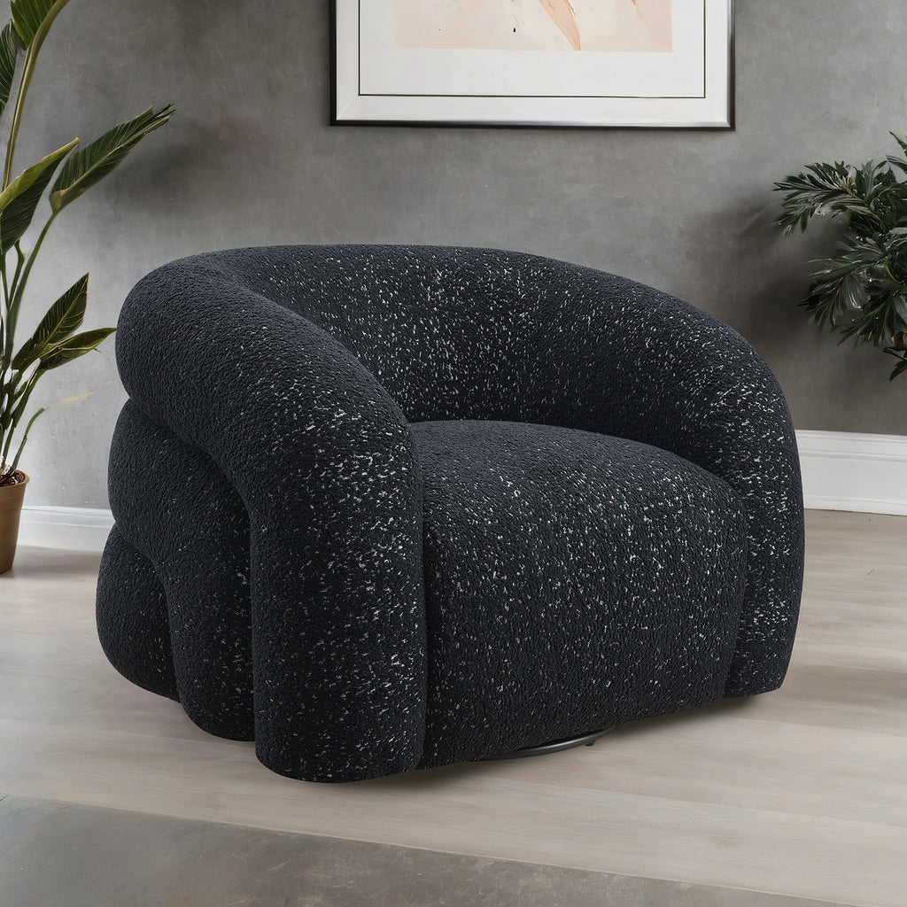 Contemporary black swivel chair with sculptural design and boucle texture, ideal for stylish interiors with 360-degree swivel functionality.