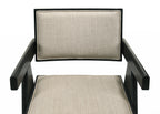 Close-up of Jasper dining chair seat and backrest in beige fabric. Black wood frame adds bold contrast and support.