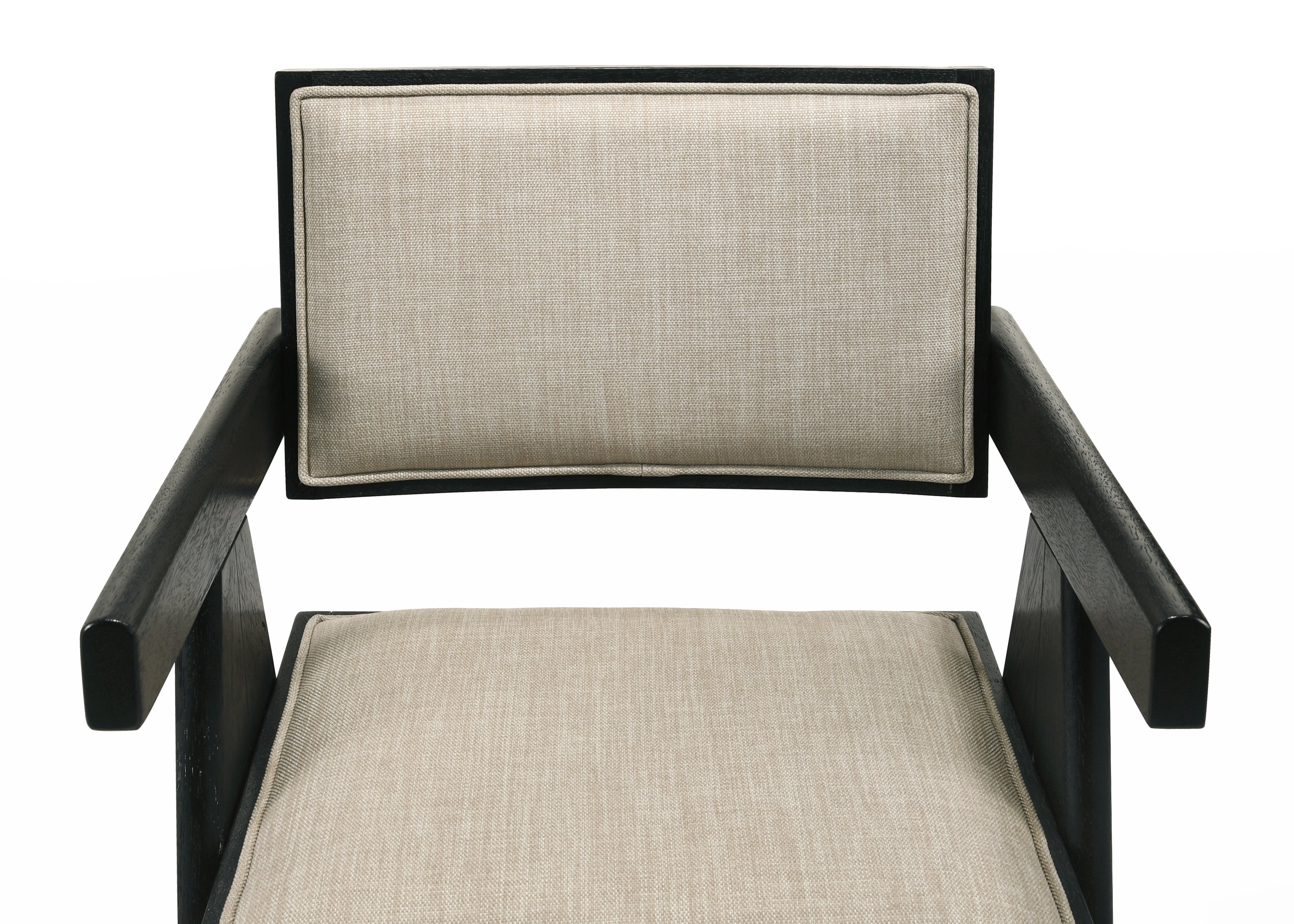 Close-up of Jasper dining chair seat and backrest in beige fabric. Black wood frame adds bold contrast and support.