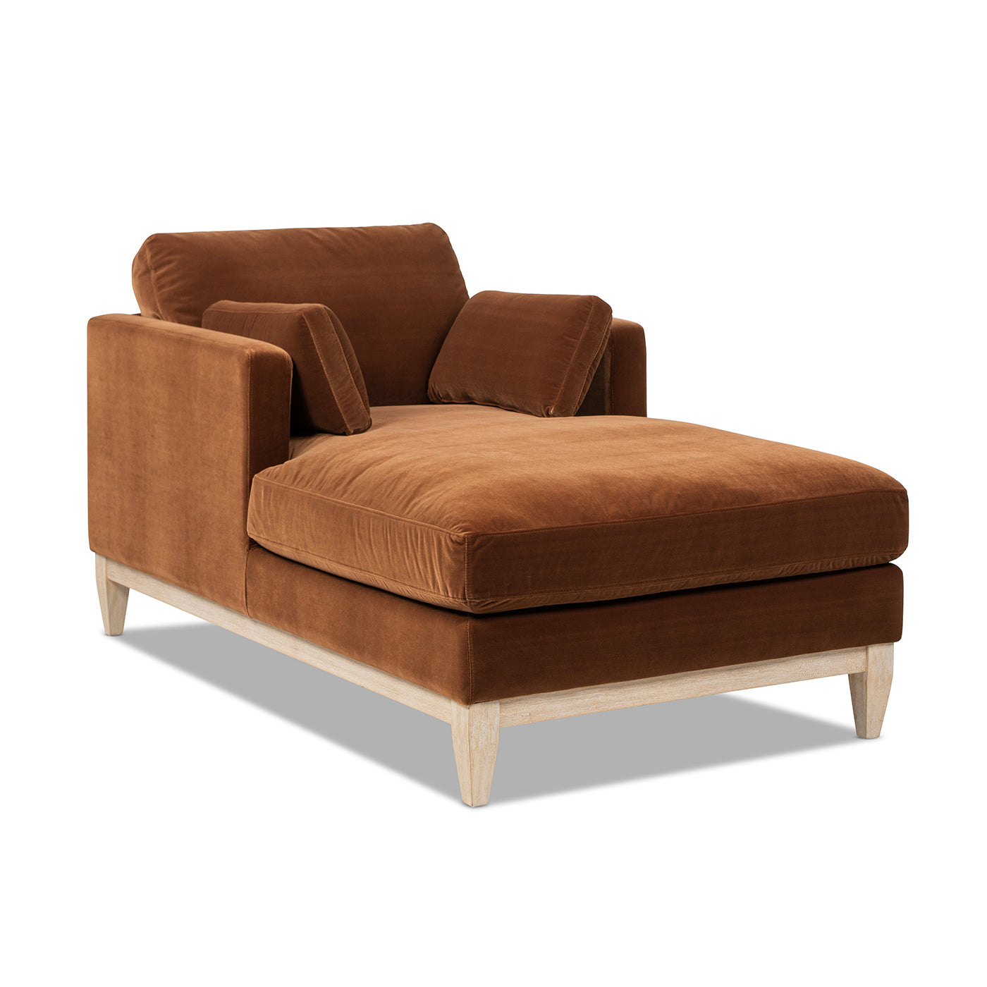 Side-angled view of Knox 65' Modern Farmhouse Chaise Lounge Chair in burnt orange velvet with light wood base and plush cushions.