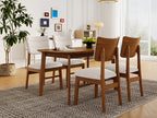 Side view of farmhouse dining table set with 4 upholstered chairs, showcasing ergonomic design and warm wood finish.
