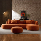 Contemporary oversized orange sectional sofa with ottoman in a loft-style room, perfect for large living spaces and modern decor.