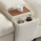 Detail of console on modular sectional sofa featuring cup holders and wooden tray. Enhances living room functionality and comfort.