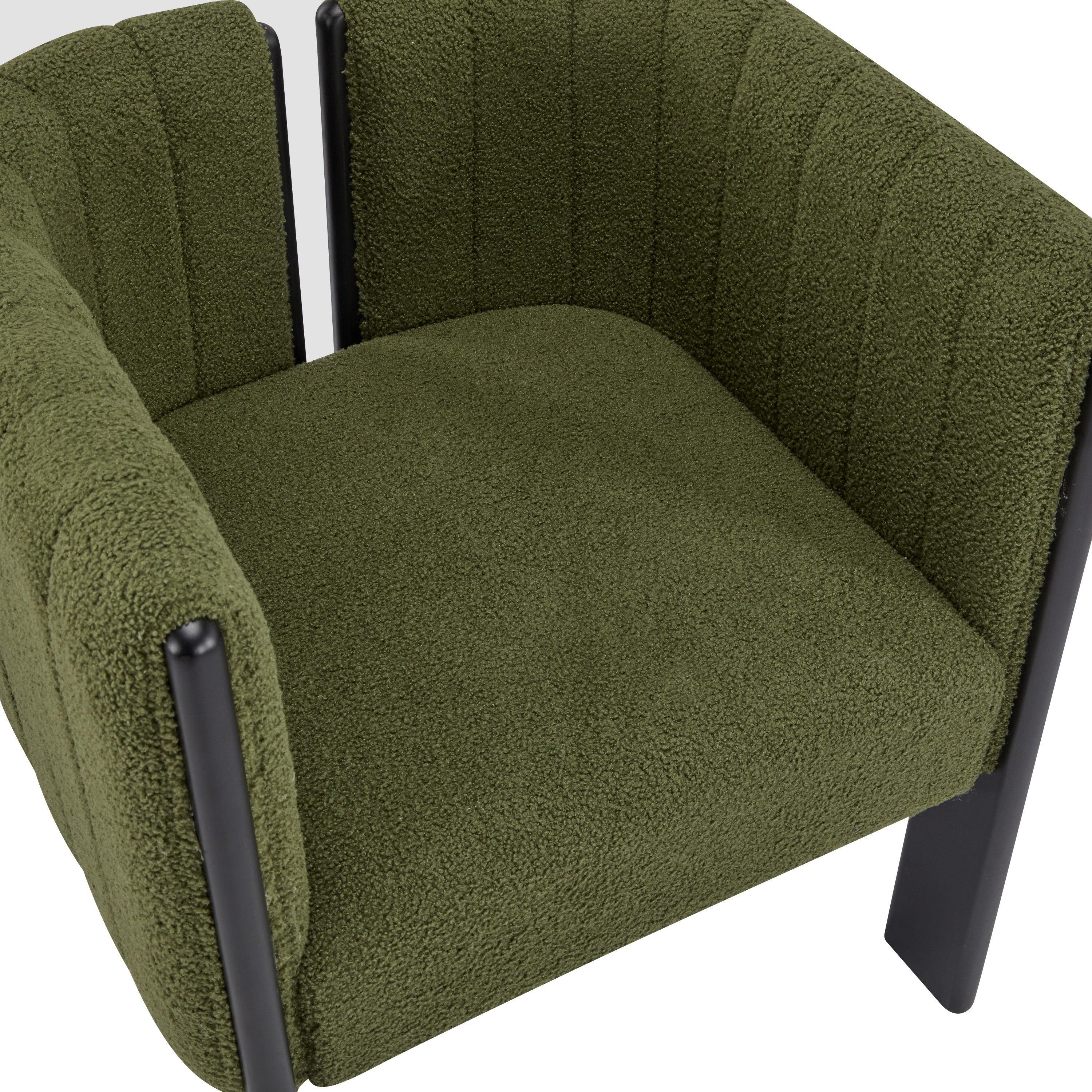 Close-up of olive green boucle seat and curved backrest on modern dining chair, emphasizing comfort and stylish texture.
