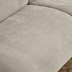 Close-up of chenille fabric texture on beige memory foam sofa seat, showcasing soft and durable material for everyday use.