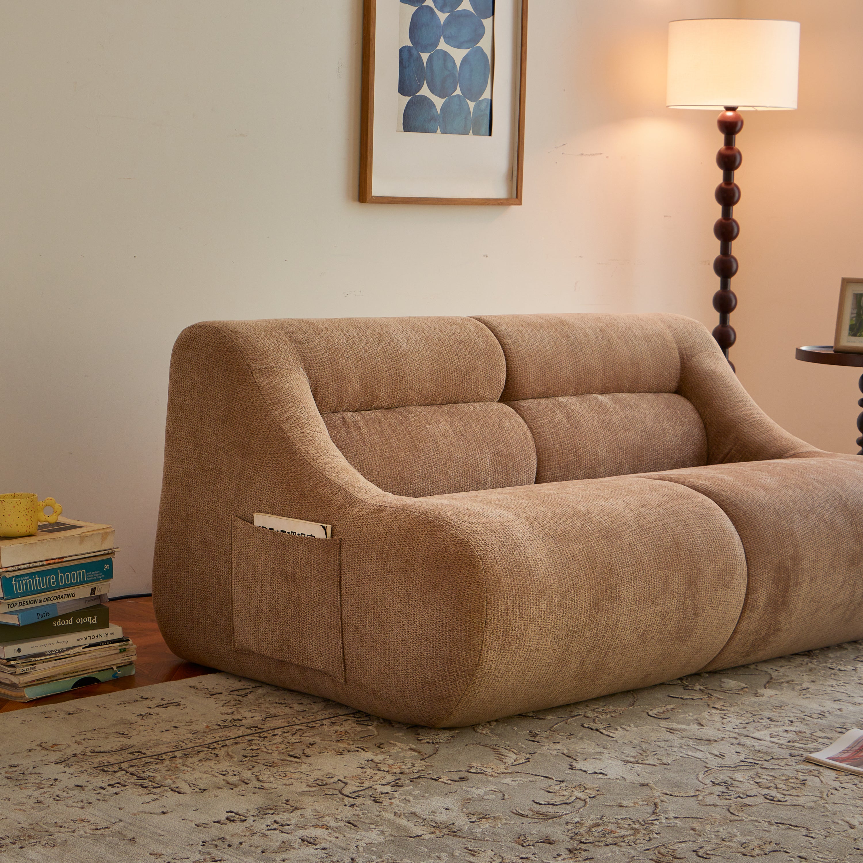 Side view of Chenille Fabric 2-Seater Sofa in brown with built-in magazine pocket, highlighting its ergonomic and space-saving design.