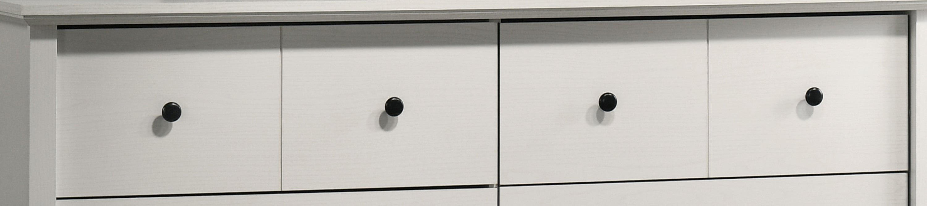 Upper drawers of Elara White 6-Drawer Dresser featuring round black knobs for a minimalist modern look.
