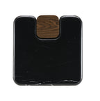 Top-down view of Dana Marble Top End Table showing the smooth black marble surface with a walnut wood inset corner for visual contrast.