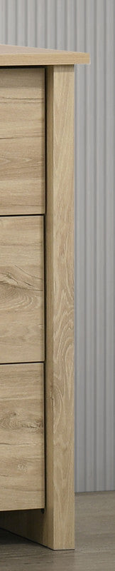 Close-up of the side panel on the Light Oak 6-Drawer Dresser - Celeste, showcasing the natural wood grain and sturdy construction.