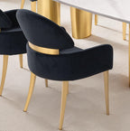 Back view of black dining arm chairs with curved design and matte gold legs, enhancing luxury dining room aesthetics.