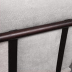 Close-up of textured light gray fabric and dark wood support bar on modular sectional sofa, emphasizing quality materials and craftsmanship.