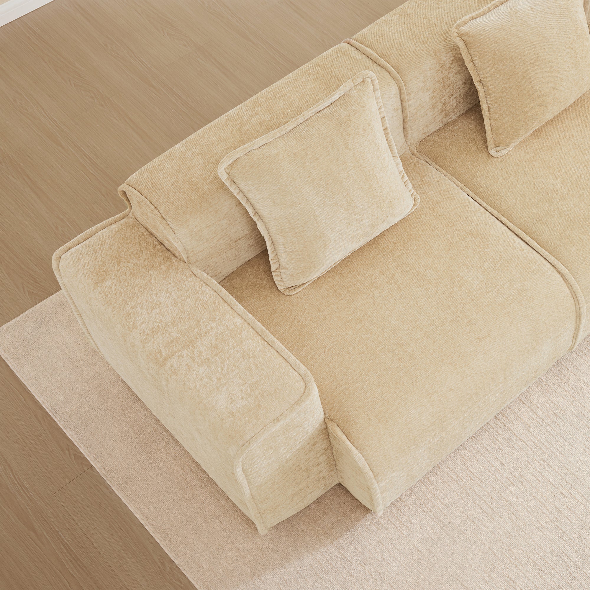 Top-down view of Velvet L Shape Modular Sofa showing soft velvet texture and included throw pillows for enhanced comfort and style.