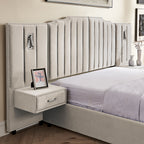 Close-up of velvet queen bed frame with vertical stripe headboard and floating bedside table featuring a drawer and framed photo decor.