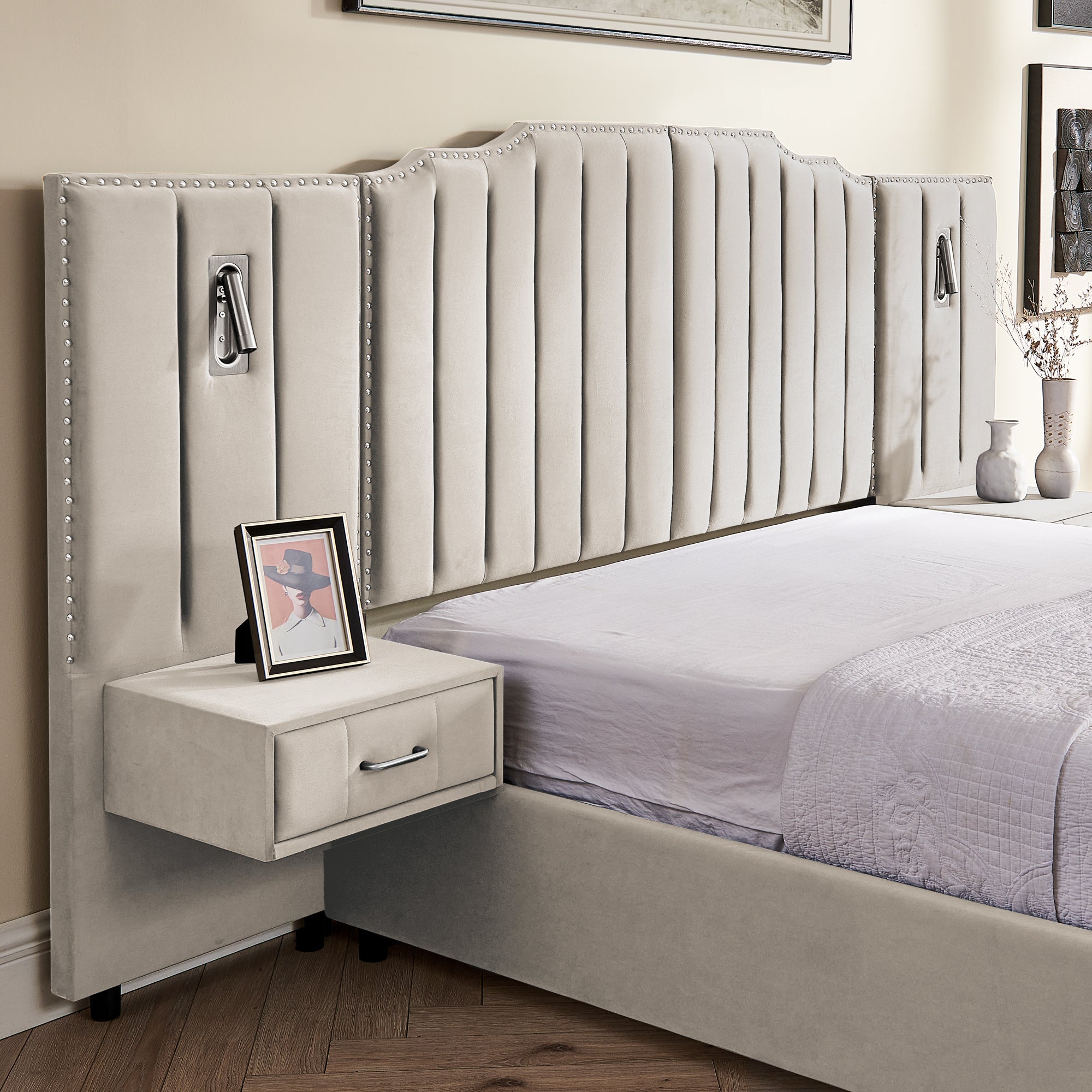 Close-up of velvet queen bed frame with vertical stripe headboard and floating bedside table featuring a drawer and framed photo decor.