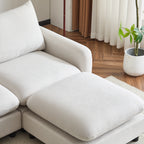 Close-up of ottoman and right armrest of the 99 in. L shaped sectional sofa, showing soft white fabric and modern design.