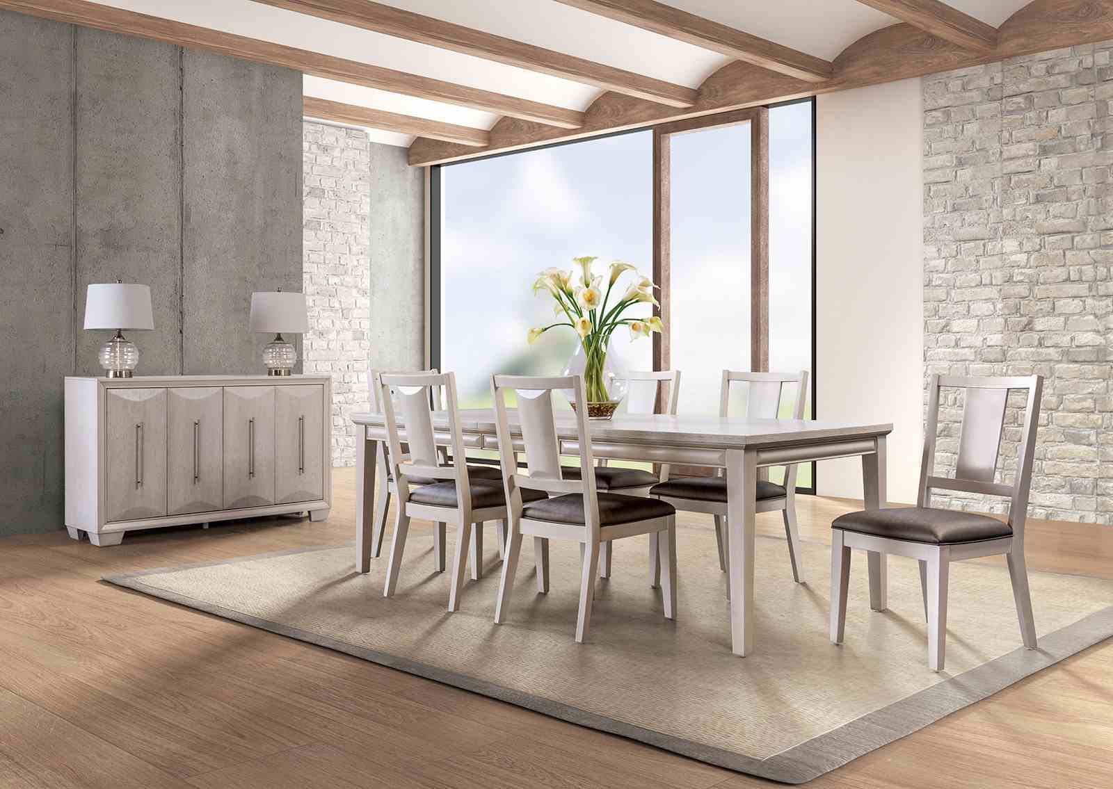Dining room setup featuring transitional oak finish chairs with padded seats and faceted backs around a matching table in a modern interior.