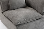 Close-up of the Cloud Couch seat cushion showing soft, textured antique grey velvet upholstery and plush foam padding.