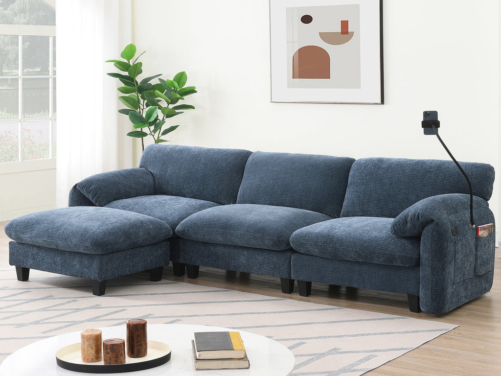 Blue modular sectional sofa with USB charger and ottoman in modern living room. Includes phone holder and side pocket for added functionality.