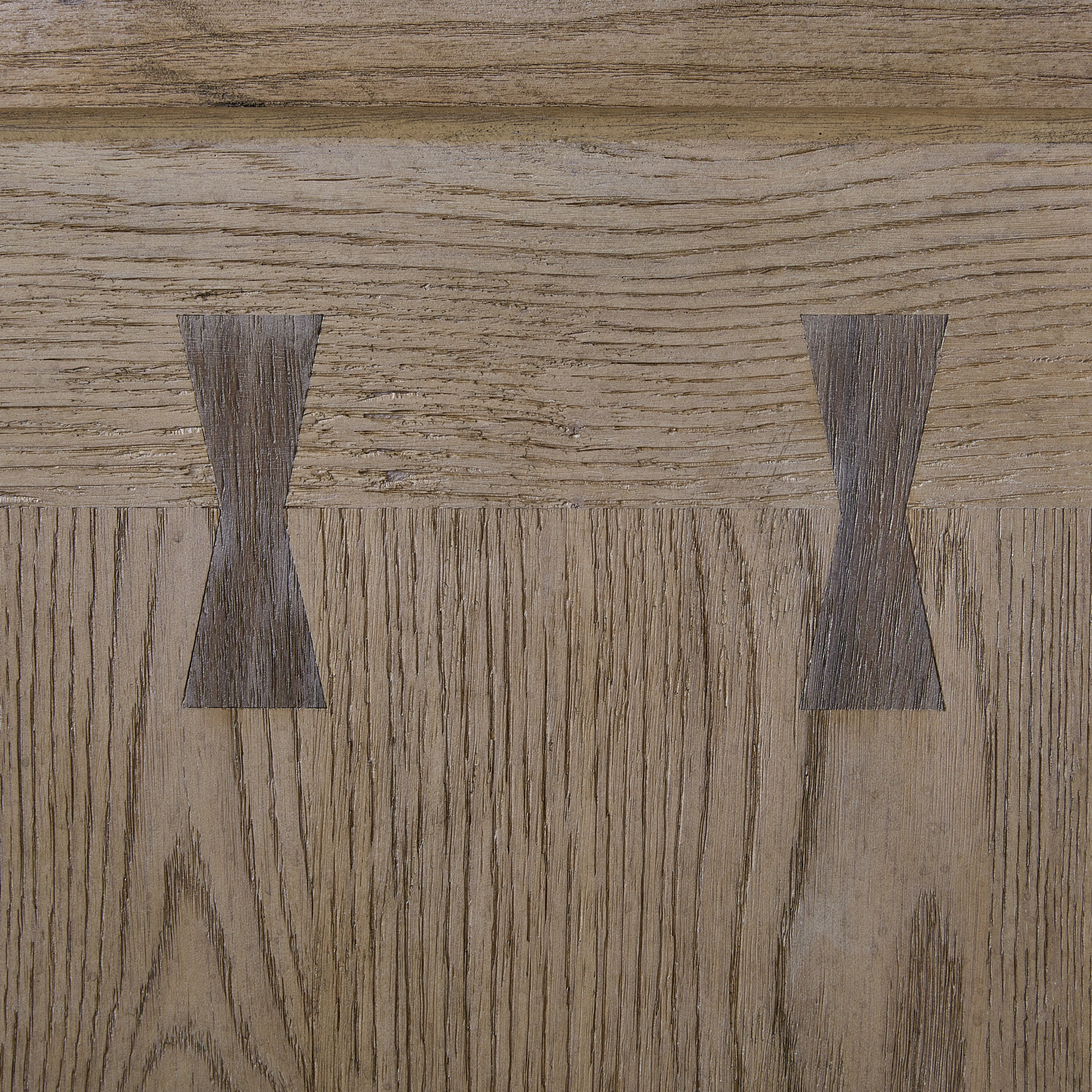 Close-up of Oak Veneer Bar Cabinet door showing detailed butterfly wood joinery and natural wood grain texture for rustic elegance.
