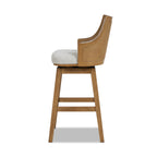 Side view of Bahama 30' Cane Rattan Swivel Bar Stool showing curved high-back design, recessed arms, and natural wood frame for stylish bar seating.