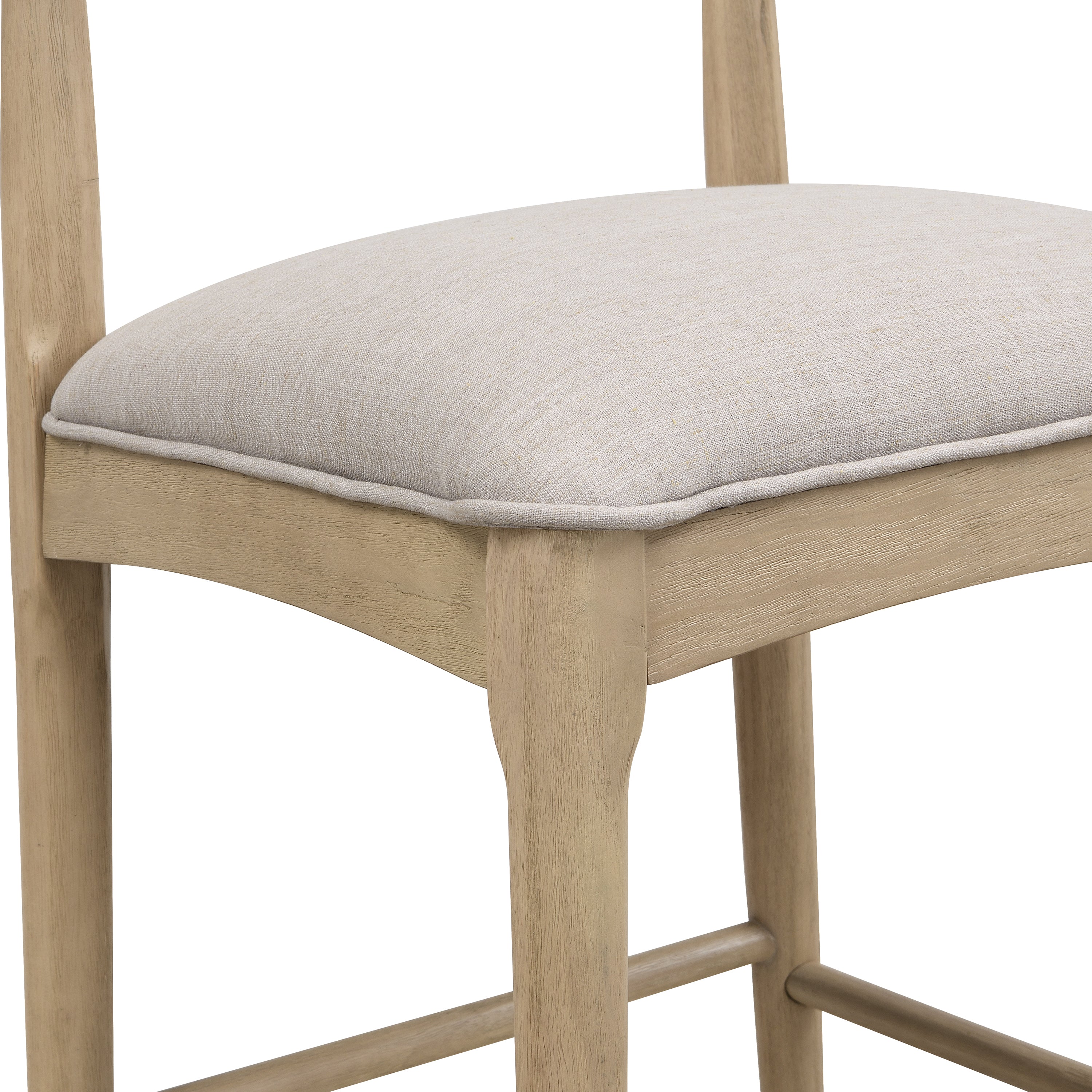 Detail of padded seat in pebble fabric on modern counter stool, highlighting stitching and comfort-focused craftsmanship.