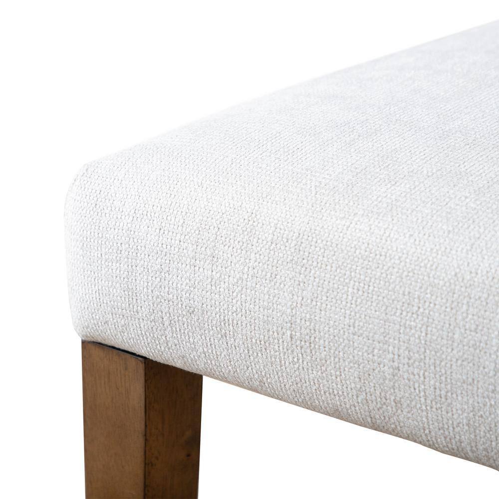 Corner close-up of rustic dining chair seat with textured white upholstery and solid wood leg, part of a 2pc set.