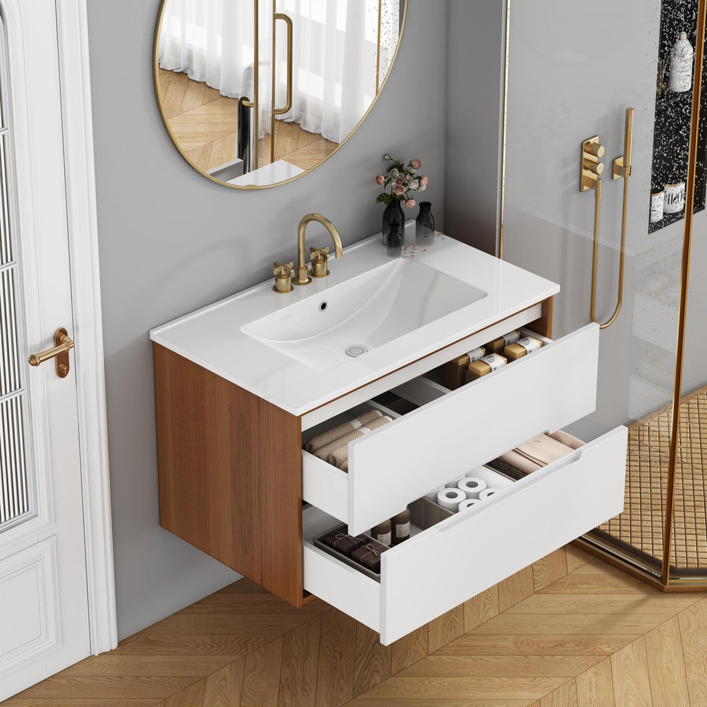 Organized storage inside 32-inch bathroom vanity with soft-close drawers, ceramic sink, and solid wood floating cabinet in walnut and white.