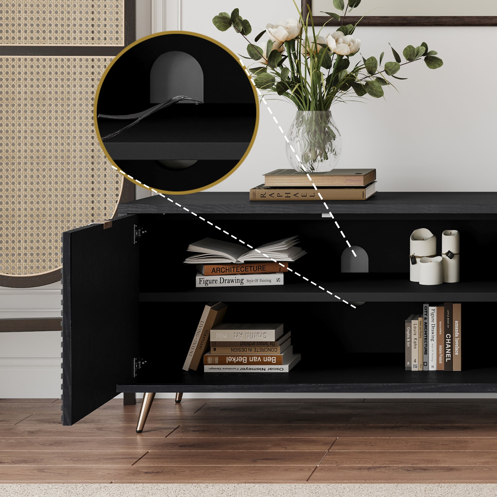 Close-up of interior shelving in black TV cabinet, highlighting adjustable shelves and cable management with books and decor items.