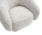 Brown Swivel Chair with Boucle Upholstery.